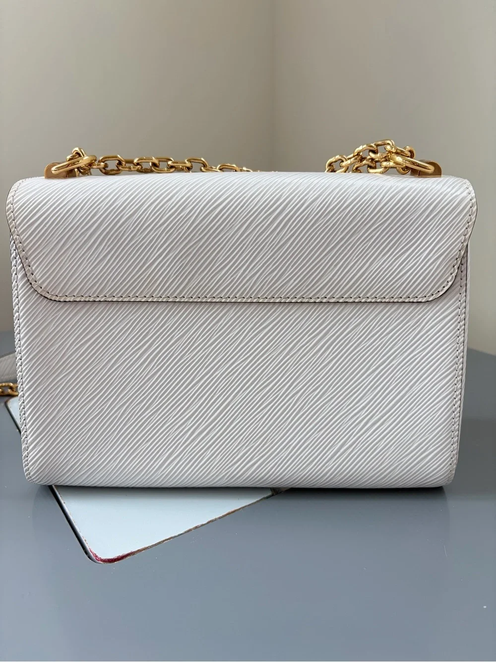 Louis Vuitton White Crossbody Bag with Gold Chain and LV Logo